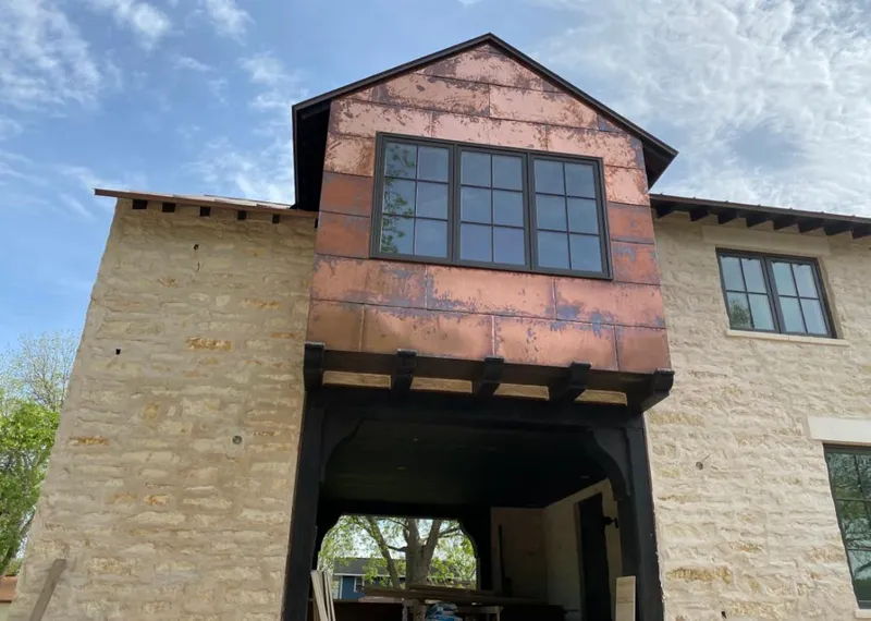 Copper metal panel facade on a stone building for Metal Roof Coating in Florida City